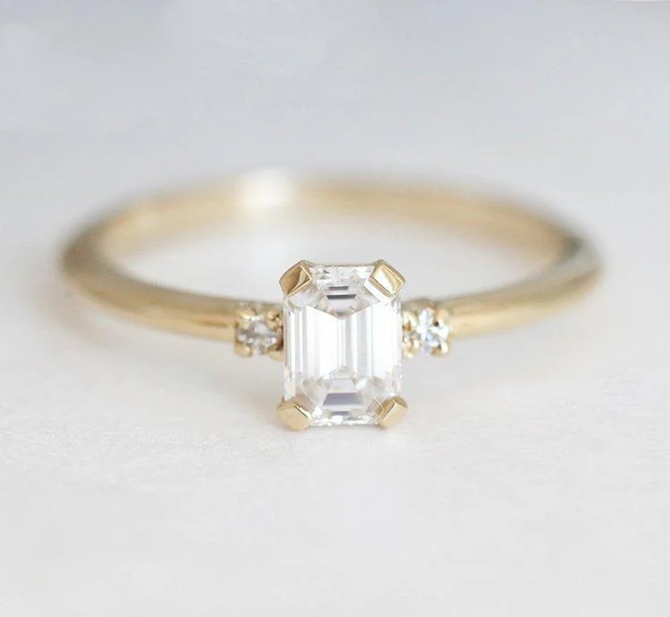 Swirl shape engagement rings-Sleek & Simple Emerald-Cut Diamond Ring With Side Diamonds